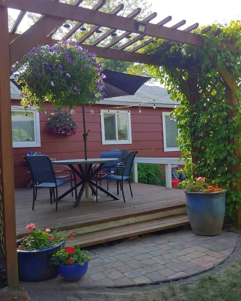 wood deck patio with pergola and string lights