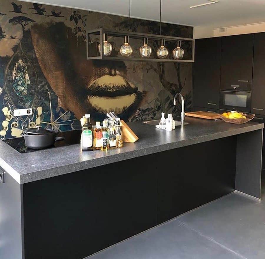 modern kitchen with unique wallpaper black island bench and track lighting 