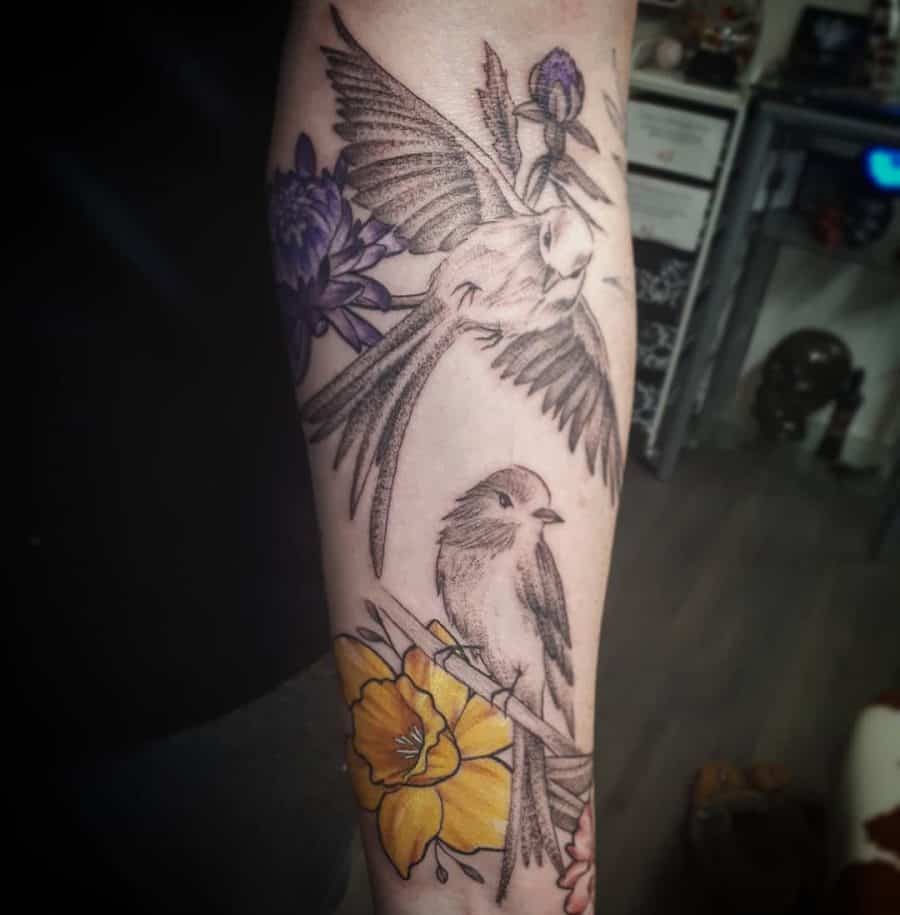 Delicate Black And Gray Hummingbirds Surrounded By Colored Flowers Unique Tattoo