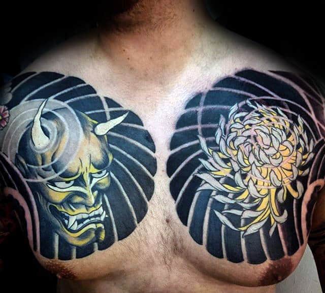 Demon Mask With Chrysanthemum Flower Mens Black And Yellow Ink Chest Tattoos