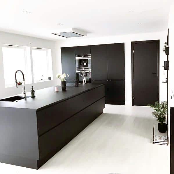 large wood island in kitchen white floor 