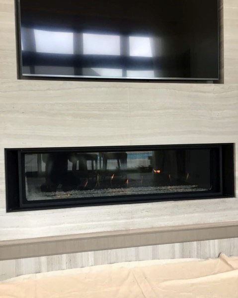 linear fireplace with TV above 