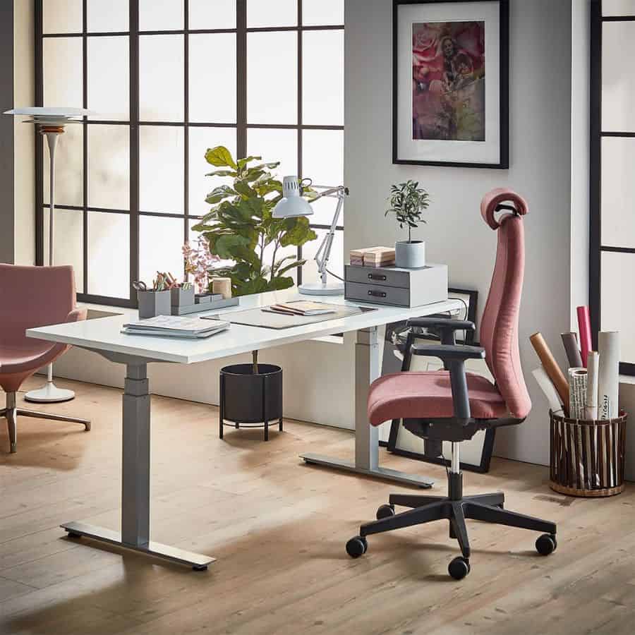 minimalist office desk set up pink office chairs plants on desk white desk 