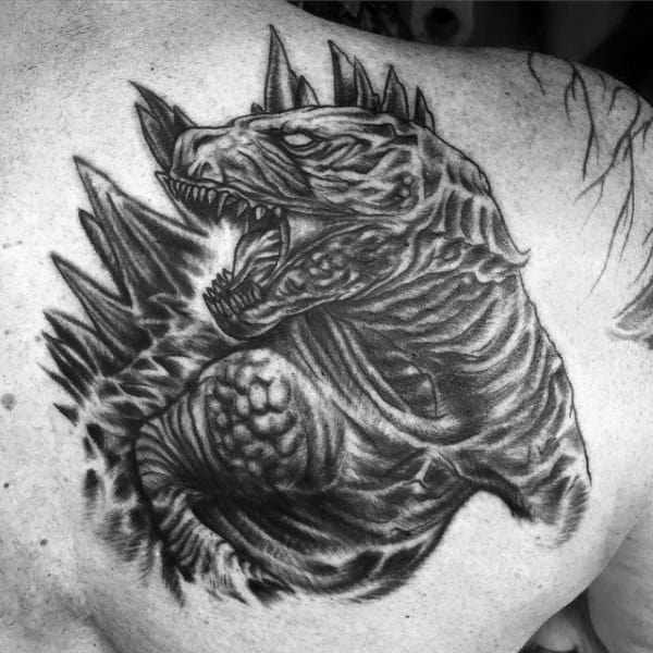 Detailed Black Godzilla Angry Tattoo On Guy