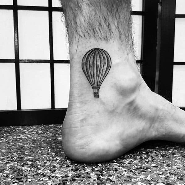 Detailed Hot Air Ballon Ankle Tattoo Design On Man
