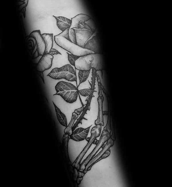 Detailed Rose Flower With Stem Skeleton Hand Mens Forearm Tattoos