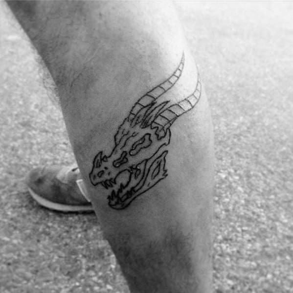 Distinctive Male Dragon Skull Tattoo Designs On Side Of Leg