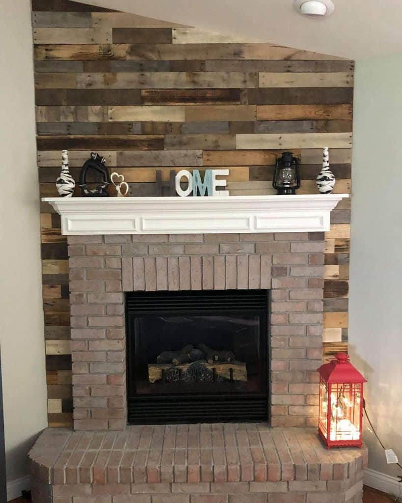 feature wood paneling wall brick fireplace red lantern 