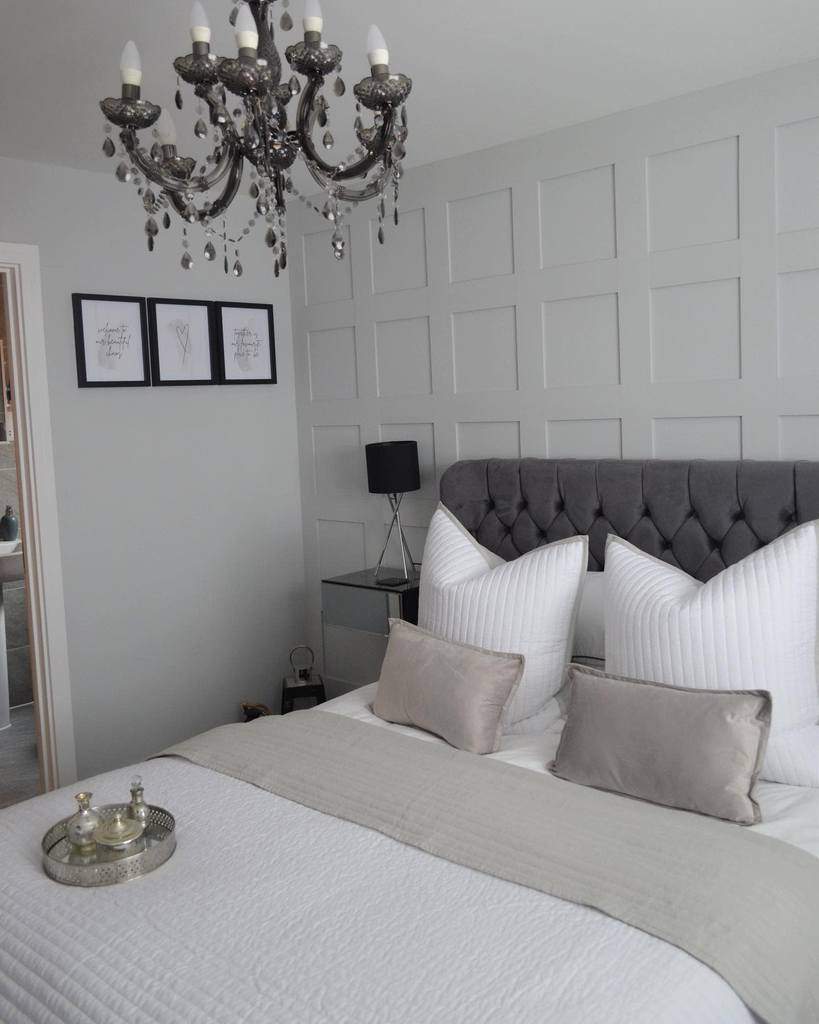 white wood wall paneling bedroom chandelier