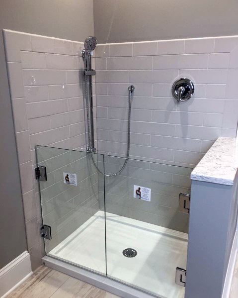 gray tile dog shower with glass door
