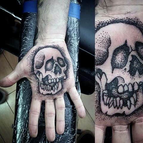 Dotted Grey Skull Tattoo On Male Palms