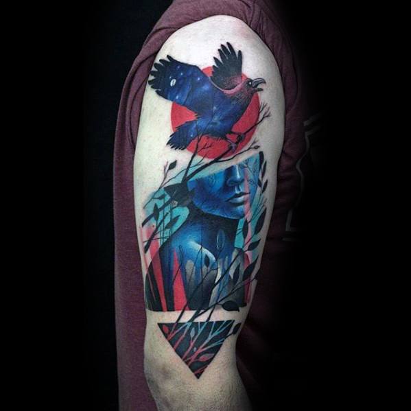 Striking tattoo of a red and blue raven flying over a fragmented portrait with plants and abstract shapes, blending nature and surrealism.
