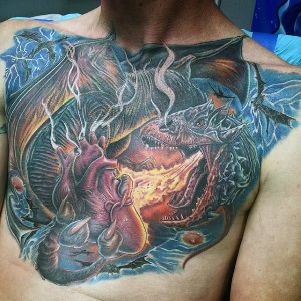 Dragon Breathing Fire On Heart Badass Guys Chest Tattoos