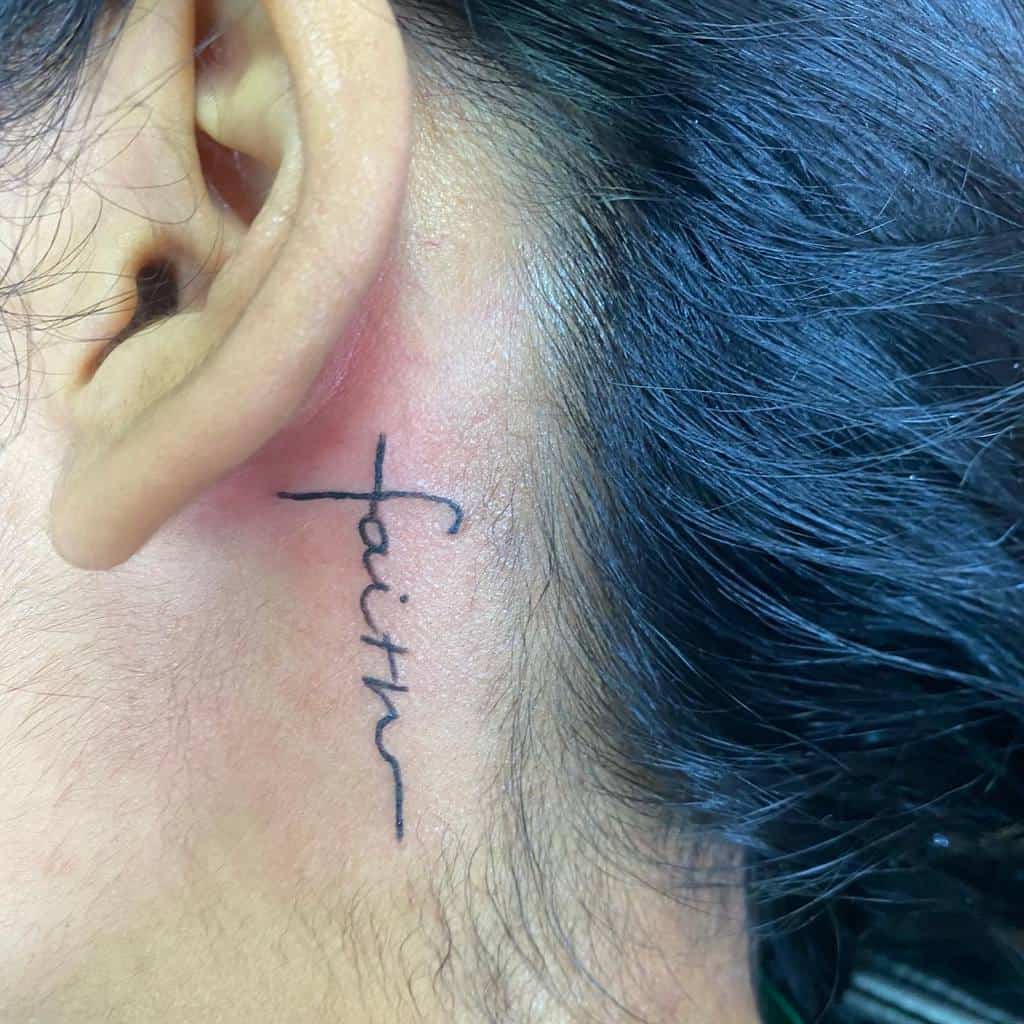 ear faith cross tattoo grafikxposure