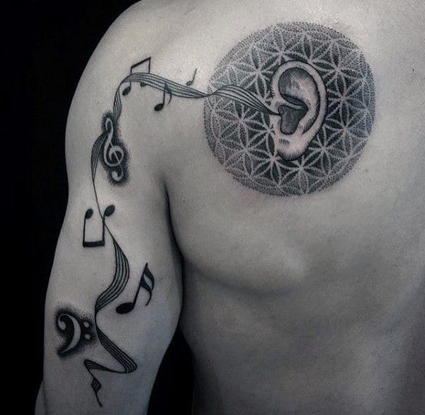 Ear With Music Note And Flower Of Life Shoulder Blade Arm Tattoo