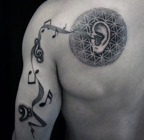 Ear With Music Notes Flower Of Life Mens Arm And Shoulder Blade Tattoo