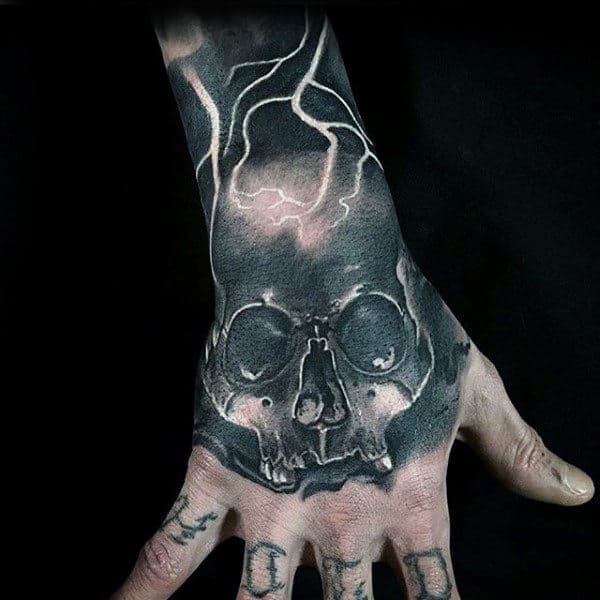 Electric Skull Crazy Hand Tattoo Design On Man