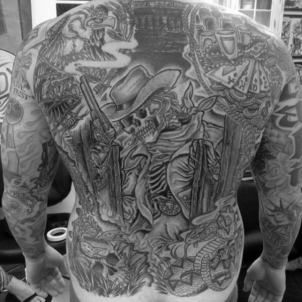 Enormous Backpiece Detailed Tattoo Of Western Scene With Skeleton Cowboy Holding Smoking Gun On Man