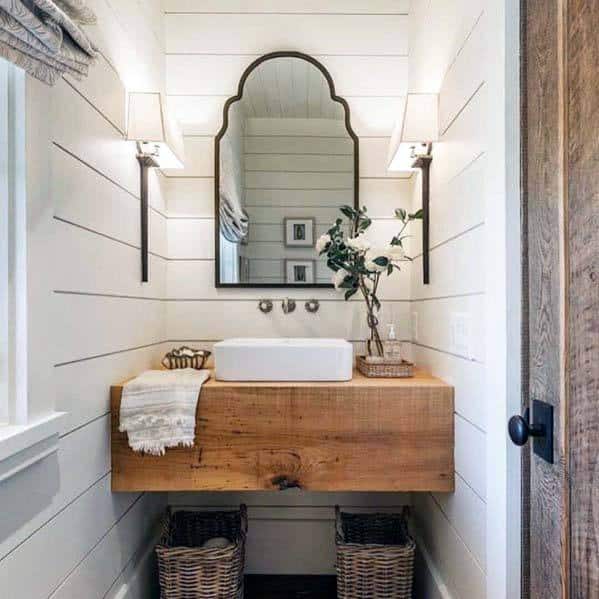 white shiplap bathroom wood vanity white sink wicker baskets wall mirror 