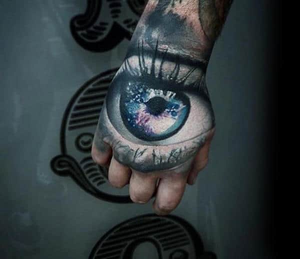 Eye With Outer Space Design Crazy Male Hand Tattoos