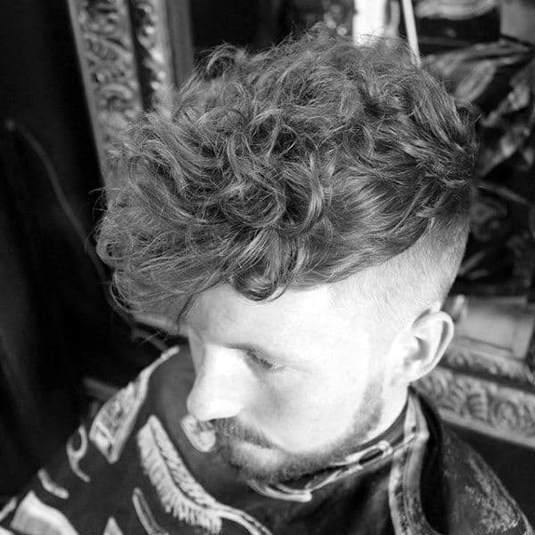 Fashionable Guys Curly Undercut Hairstyle