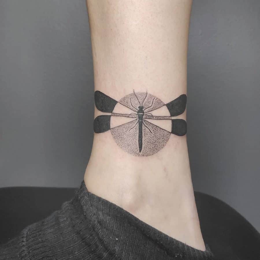 Fat Black Negative Space Dragonfly Cicular Framed Fill Intense Dotwork Geometric Tattoo