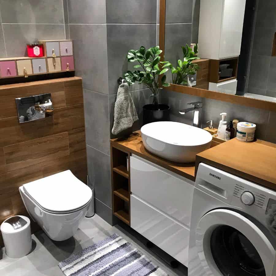 modern powder room laundry with floating toilet and washer