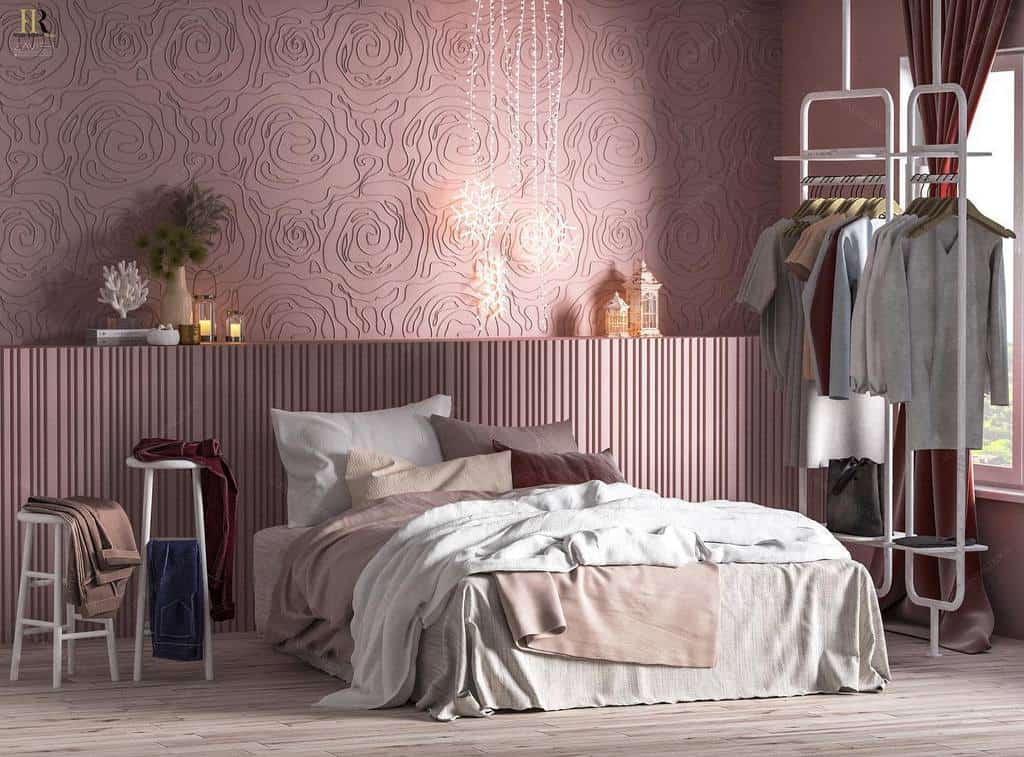 Bedroom with textured pink walls, platform bed, clothes hanger, and soft lighting decor.