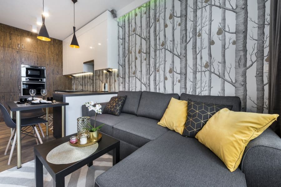 tree wallpaper accent wall in open plant apartment kitchen living space 