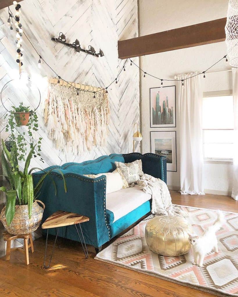 rustic white wood feature wall in boho living room with blue sofa 