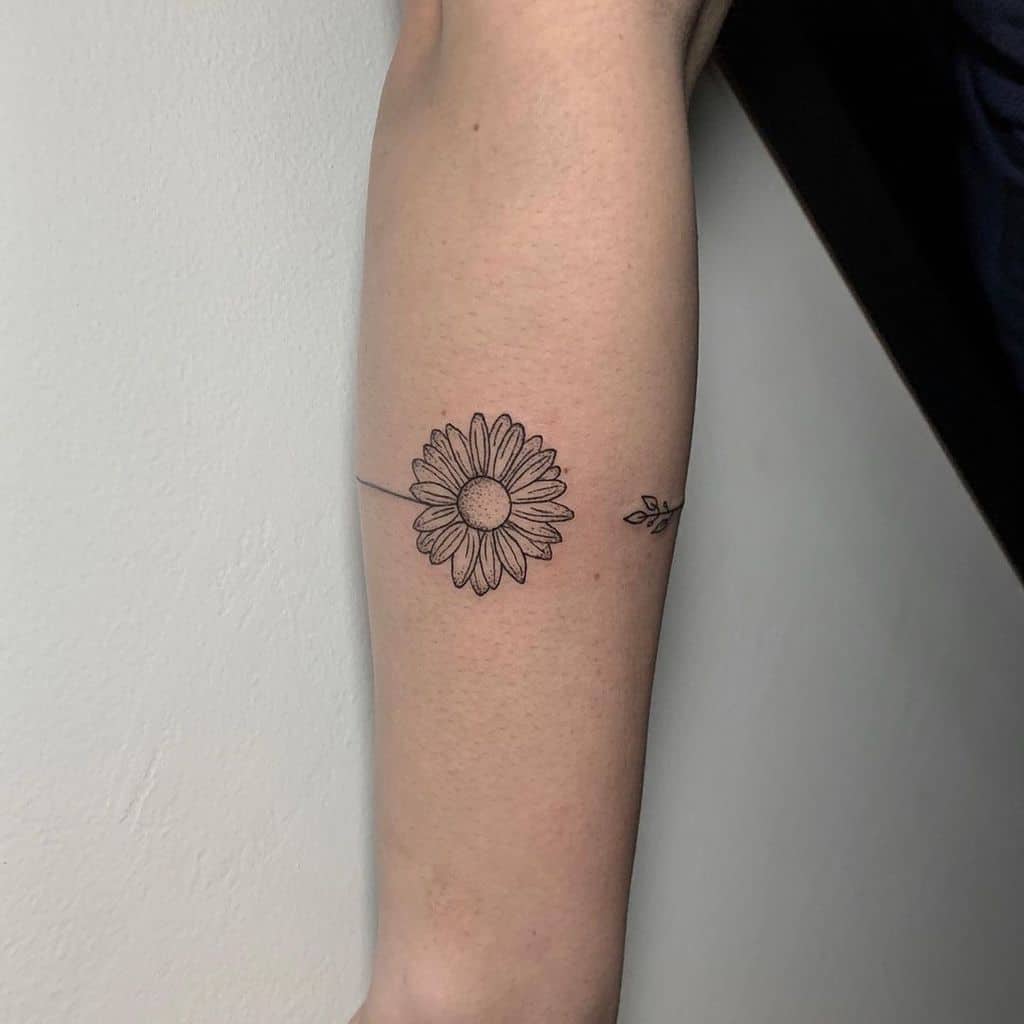 Forearm tattoo wrap around black and grey fine line delicate daisy