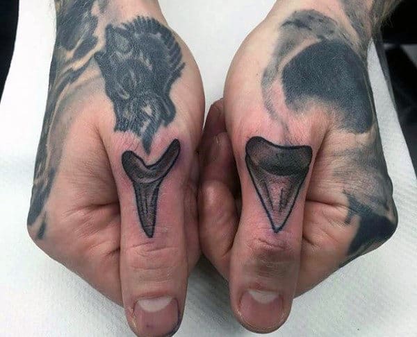 Shark Tooth tattoo on hand