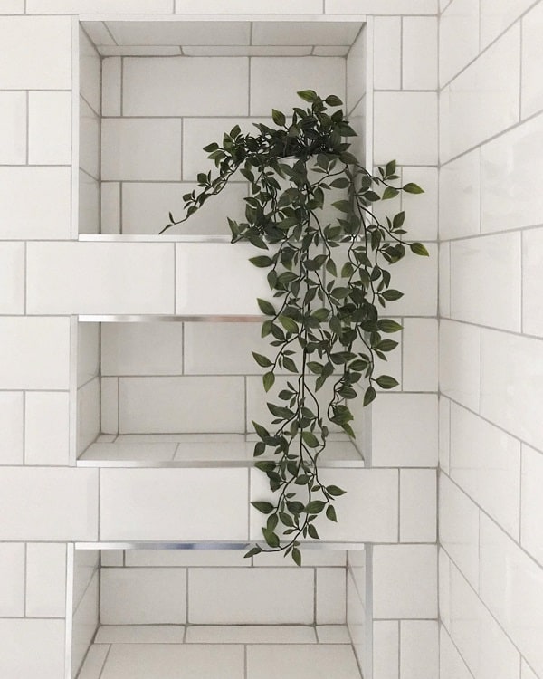 white tiled bathroom recessed shelf 