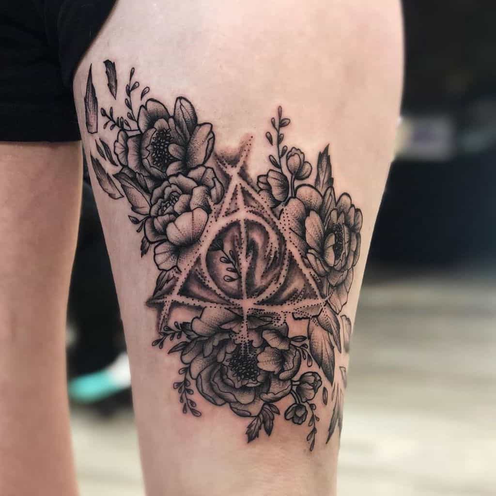 floral deathly hallows thigh tattoo harry potter