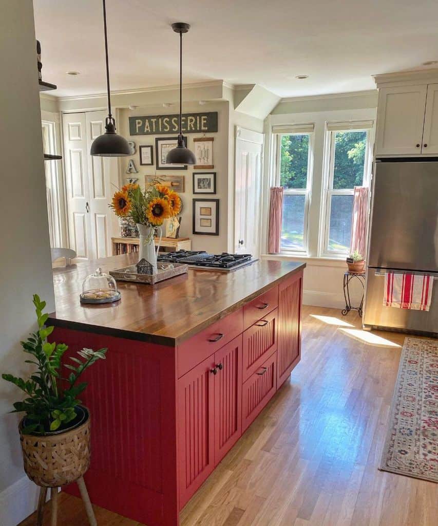 country kitchen red island wood countertop flowers