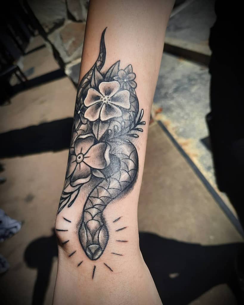 flower snake arm tattoo themanofmanyskills