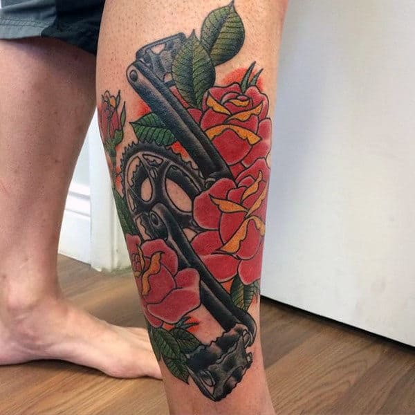 Flowers And Bicycle Pedal Tattoo On Legs For Men