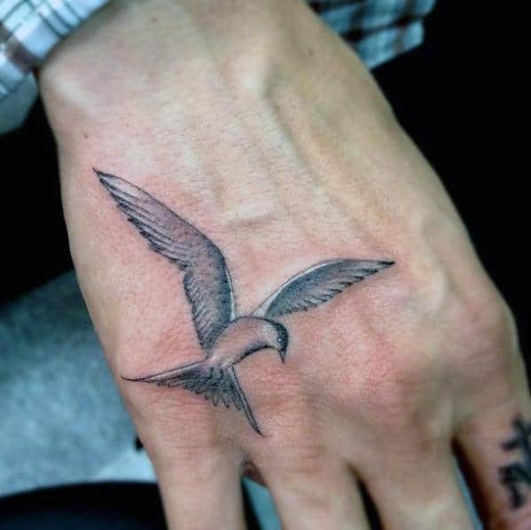 Flying Bird Shaded Black And Grey Small Hand Tattoos For Men