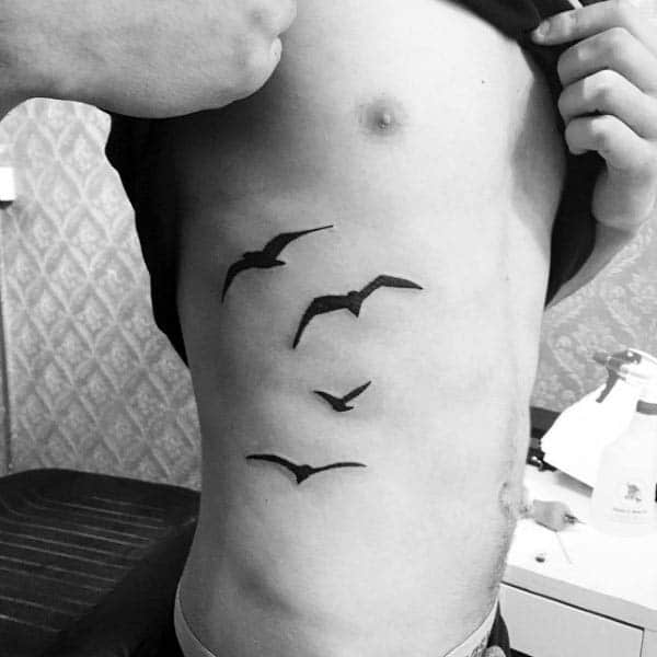 Flying Birds Silhouette Rib Cage Side Tattoos For Gentlemen