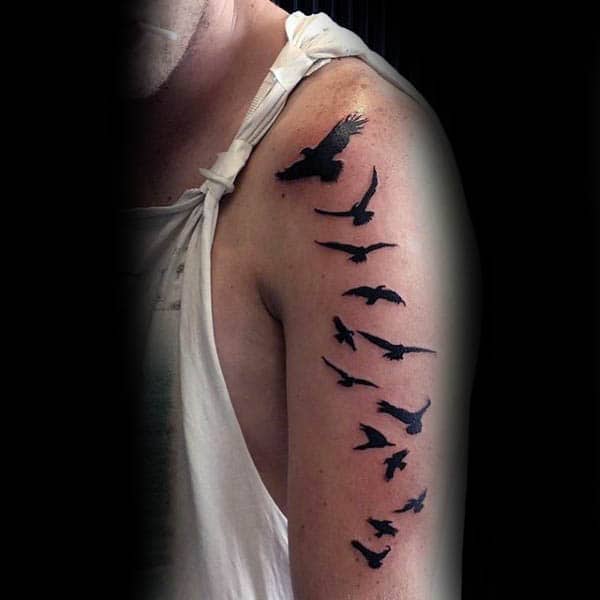 Flying Birds Silhouette Tattoos For Guys On Upper Arm