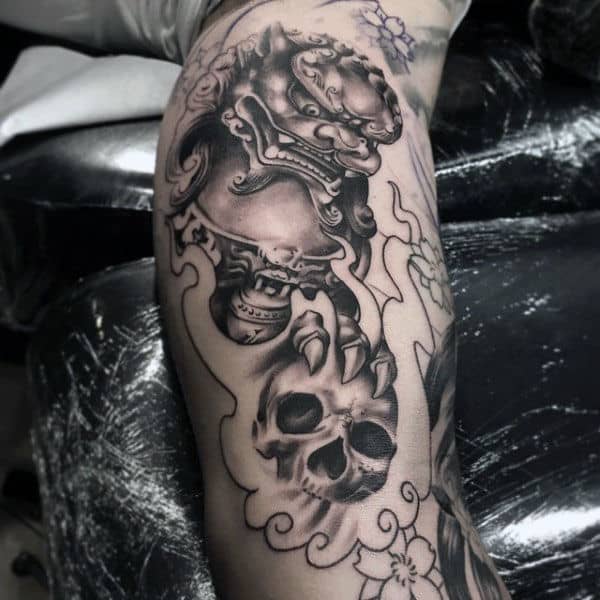 Foo Dog Holding Skull Mens Inner Arm Tattoo