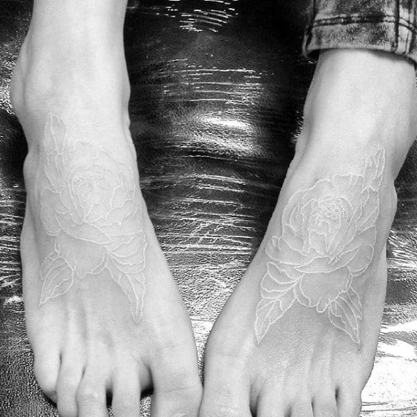 Foot Tattoo Of White Ink Roses On Gentleman