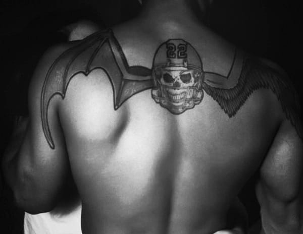 Football Skull With Wings Mens Upper Back Tattoo Design Ideas