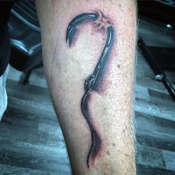 Forearm Caught Fish Hook Skin Tattoo For Men