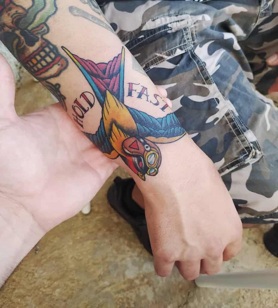 forearm hold fast tattoos metrallainktatto