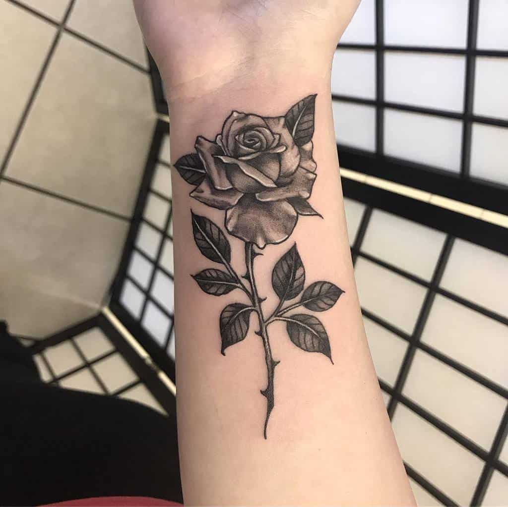 4. Forearm Rose with Stem Tattoo Ideas.