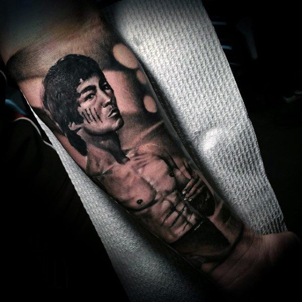 Realistic style Bruce Lee tattoo
