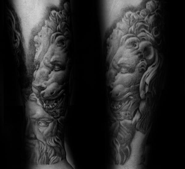 Lion of Madrid tattooed on the forearm black and grey