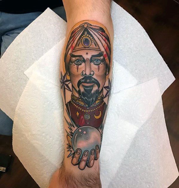 Fortune Teller Guy With Crystal Ball Tattoo Design On Leg