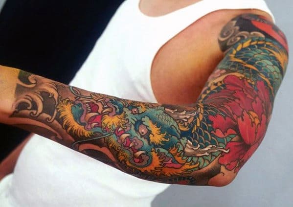 Full Arm Blue And Yellow Dragon With Flower Mens Tattoo Ideas